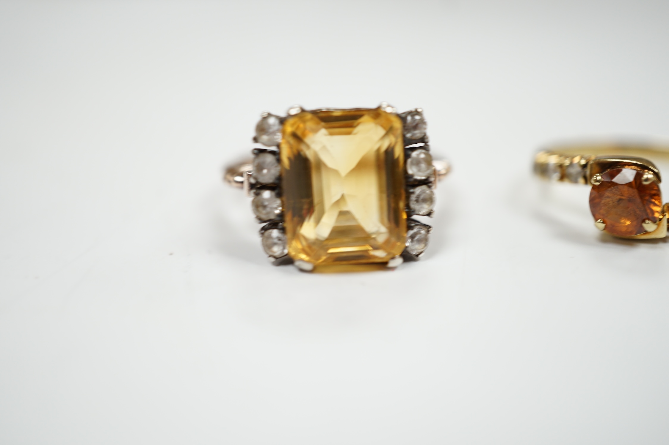 Two yellow metal citrine and simulated diamond set rings, gross weight 7.4 grams.